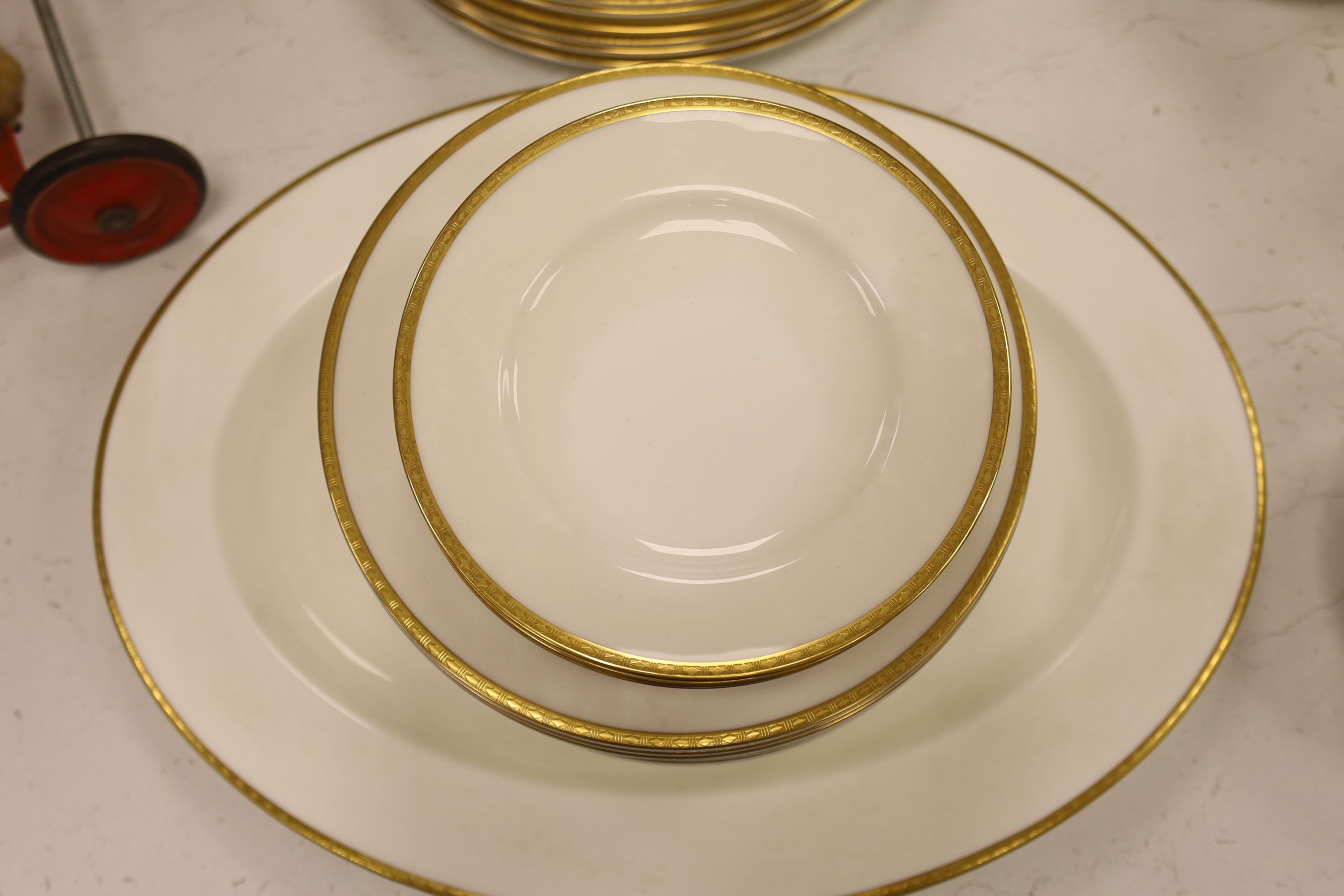 A Minton 'Golden Heritage' gilt bordered dinner service